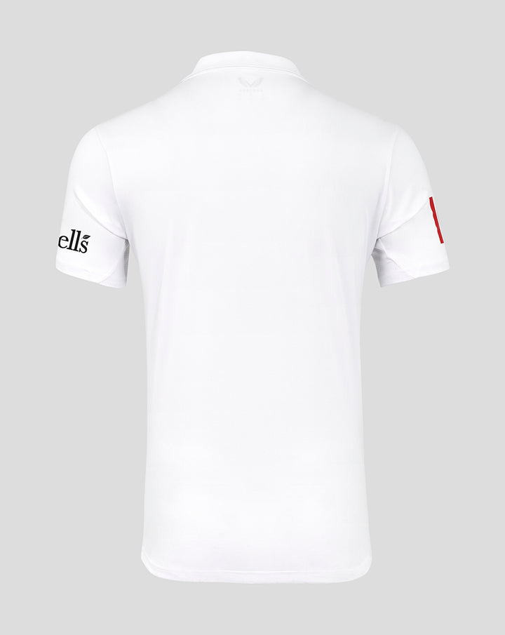 Front view of a white Test cricket shirt featuring a red collar detail and large Toyota sponsor logo.