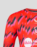 Close up of red pink geometric pattern on Welsh Fire training T shirt with crest and Vitality sponsor logos.