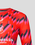Close up of bold red and pink geometric print across the chest and shoulder of the Welsh Fire training T shirt.