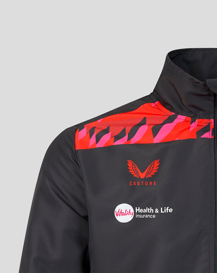 Shoulder detail of a black Castore jacket with red pink pattern crest and Vitality sponsor logo