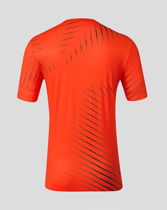 Back view of bright orange Sunrisers Leeds training T shirt with dark diagonal stripe pattern