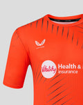 Close up of upper chest showing Castore branding at neck and Vitality sponsor logo on a bright orange Sunrisers Leeds training tee