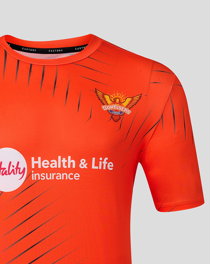 Close up of chest on bright orange Sunrisers Leeds training T shirt showing crest on left and Vitality Health & Life Insurance logo