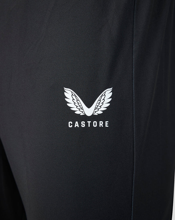 Close up of black Castore pant fabric with white wing logo