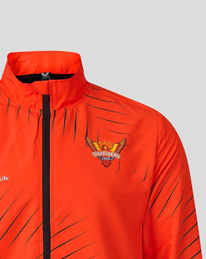 Bright orange Sunrisers Leeds The Hundred woven pre match jacket with front black zipper and crest on the chest