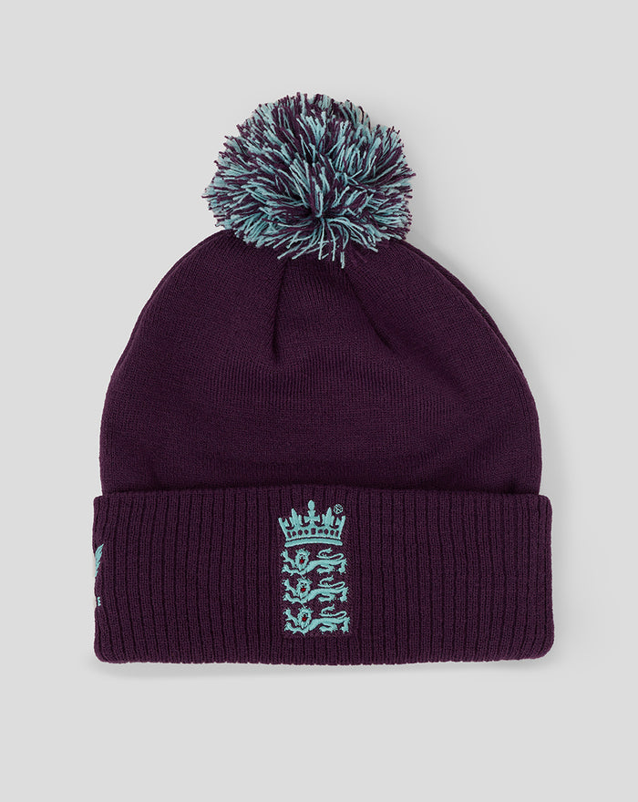 Purple knit bobble hat with teal pom and England crest on the front