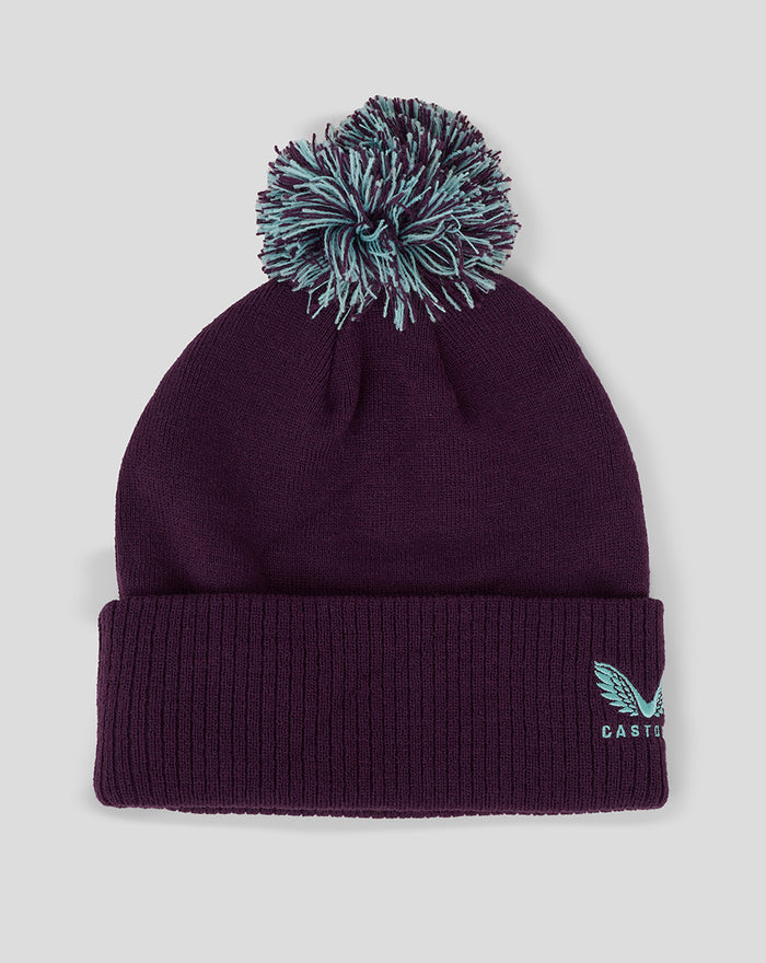 Purple bobble hat with teal pom and Castore motif on the cuff