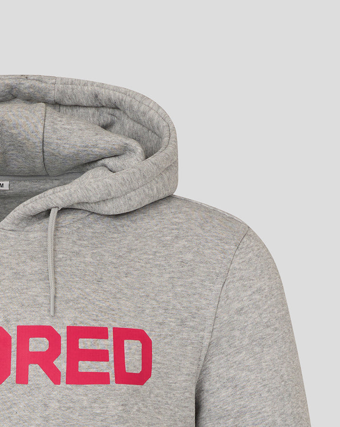 Close-up of grey hoodie front displaying a bold pink HUNDRED graphic across the chest.
