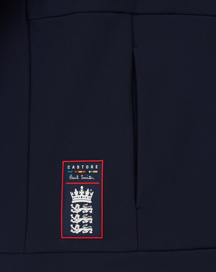 Navy hoodie front lower panel featuring Castore Paul Smith label patch with crest design