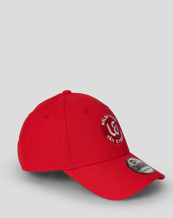 Red Welsh Fire New Era 9Forty cap shown from the side with embroidered crest on the front and textured fabric